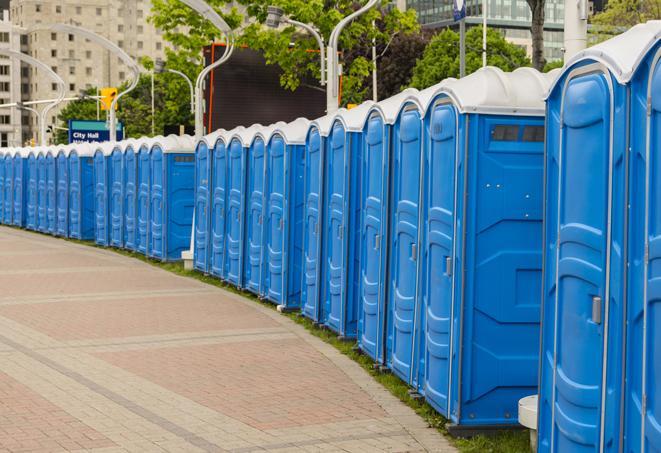 a line of portable restrooms at an outdoor wedding, catering to guests with style and comfort in Bethesda, MD